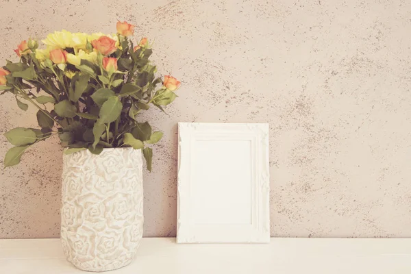 White Frame Mock Up, Digital MockUp, Display Mockup, Styled Stock Photography Mockup, Colorful Desktop Mock Up. Rustic vase with orange roses and yellow chrysanthemums. White background, empty place,