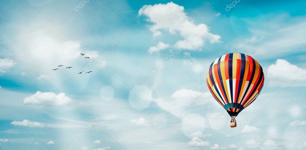 Hot air balloon on blue sky background