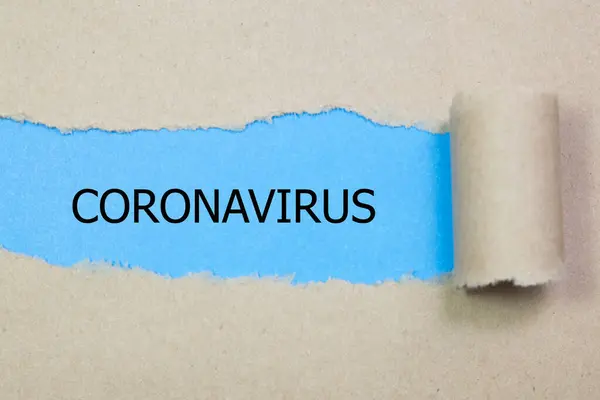 Parola Coronavirus Appare Dietro Carta Strappata — Foto Stock