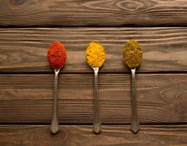 Spice powder on a wooden background. — Stock Photo, Image
