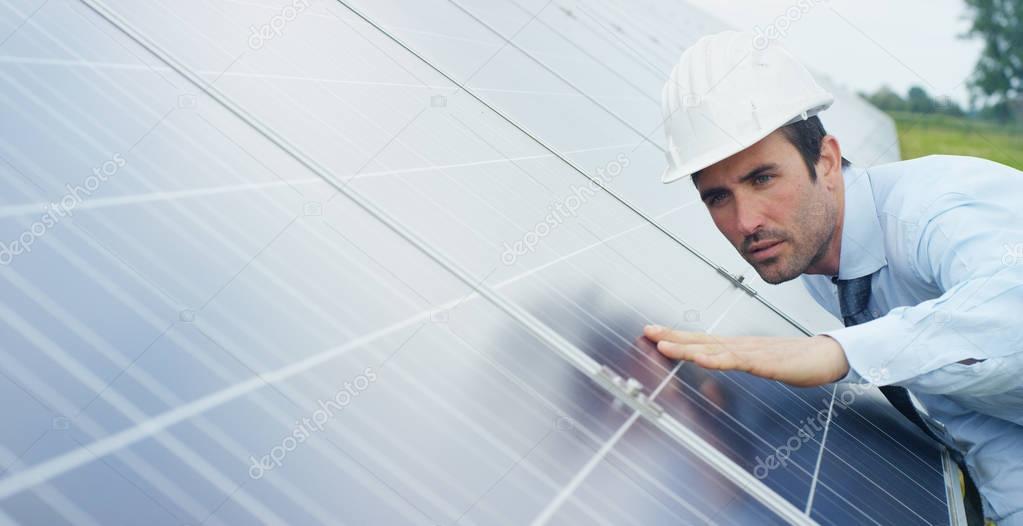 Engineer expert in solar energy photovoltaic panels with remote control