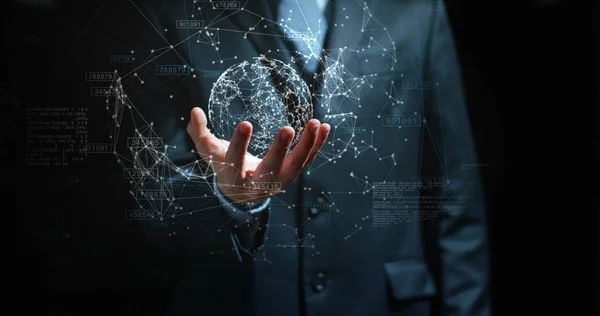 A businessman in a suit uses holography and augmented reality to see in 3D graphics financial economics on a black background. Concept: immersive technology, business, economy, futuristic — Stock Photo, Image