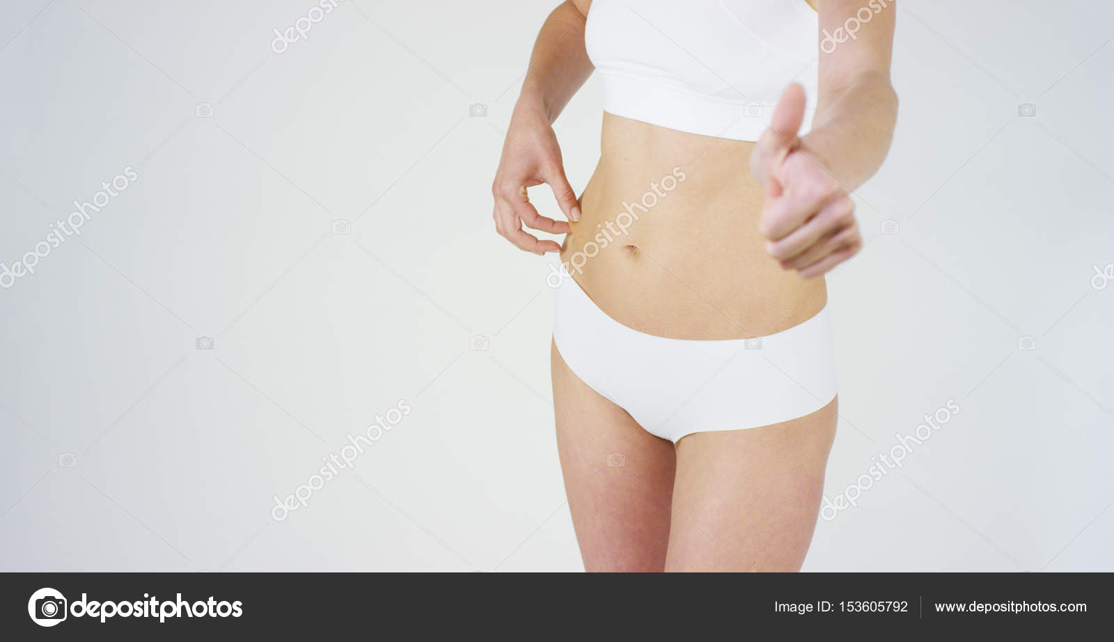 Beautiful Body Of A Young Girl Showing Off That She Is In Perfect On White Background Conceptdietproper Nutritionsports Bodyslender Bodywork On Beautiful Body Of A Young Girl Showing Off That She Is In Perfect On White Background Conceptdietproper Nutritionsports Bodyslender Bodywork On