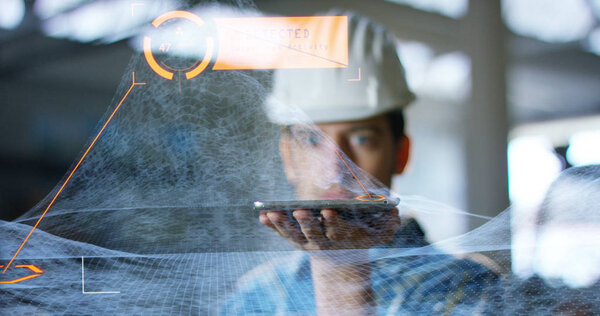 A worker uses a future technology platform to verify the design in holography and augmented virtual reality. Concept: future technology, multimedia technology, futuristic engineering.