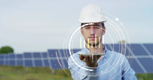 Engineer expert in solar energy photovoltaic panels with remote control performs routine actions for system monitoring using clean, renewable energy. concept applied to the remote support technology. — Stock Photo, Image