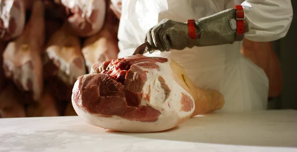 Slow motion salting of parma ham professional and traditional of the history and culture of genuine and healthy food — Stock Image Slow motion salting of parma ham professional and traditional of the history and culture of genuine and healthy food Royalty Free Stock Images