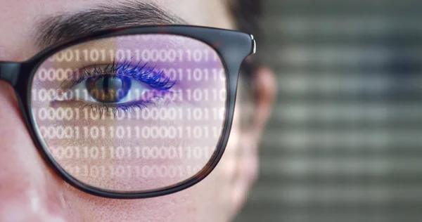 A woman watches with a futuristic look with glasses. augmented reality in holography. — Stock Photo, Image