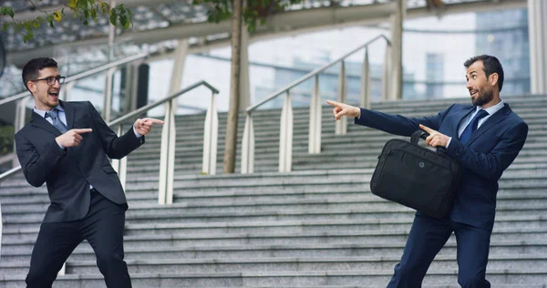 In the city two businessman they shake hands and smile before starting to collaborate on a project. Concept: teamwork, business, contract, bank. — Stock Photo, Image