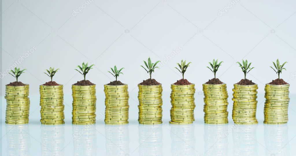 A businessman in a suit and tie with pile up golden coins and waveform lines expressed concept of stock market, growth stock market, economic profits, stock exchange