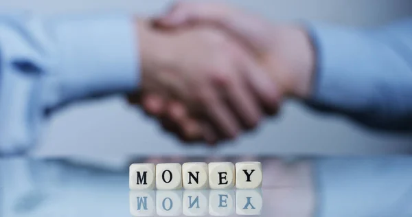 Slow motion macro of the word "Money" of the wooden letter blocks . Concept of financial market and future of stock market business. — Stock Photo, Image