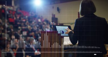 woman holds a speech to the audience in an futuristic and technology auditorium on a convention of economics and finance their business.concept:world economy,futuristic conference,holograms,technology