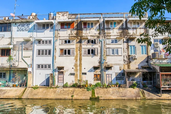 Thai houses along Khlong Rob Krung Canal in Bangkok, Thailand