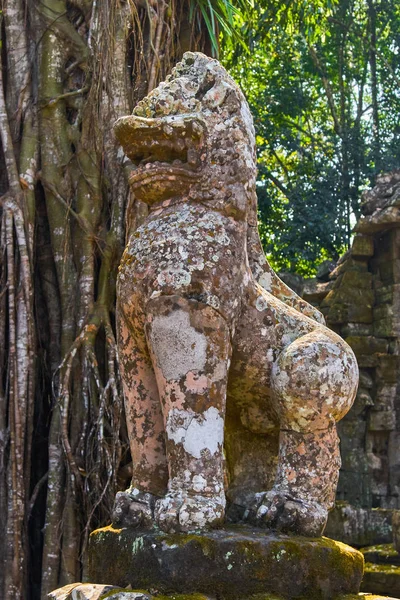 Stone statue of mythical guardian on the entrance to Preh Khan