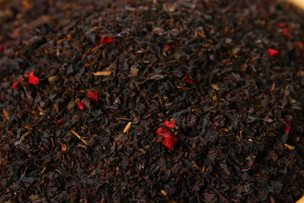 Struttura di erbe di tè. Tè nero. Foglie di tè nero secco biologico . — Foto Stock