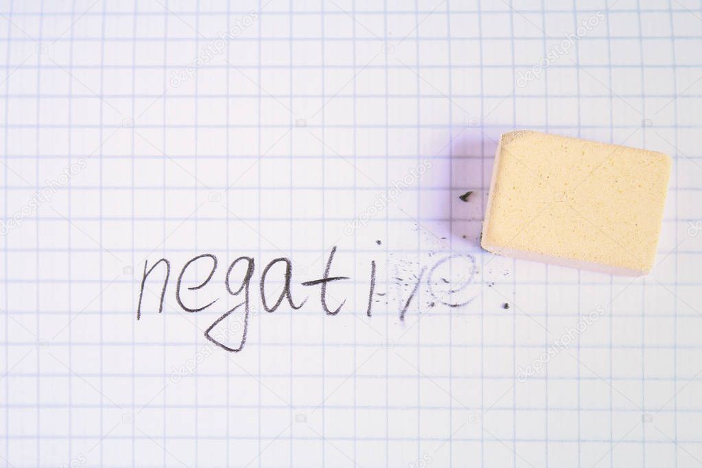 Eraser erasing on the sheet in the cage word: negative.