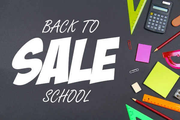 School and office supplies on blackboard background. Top view with copy space. Back to school sale. — Stock Photo, Image