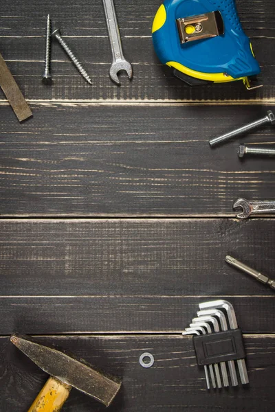 Joinery tools on a dark wooden table. Place for the text. A conc — Stock Photo, Image