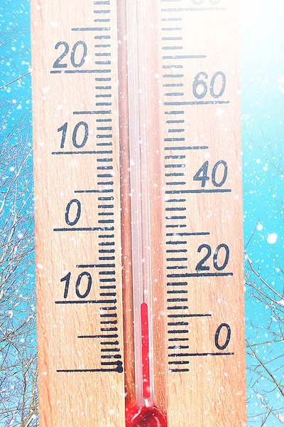 Cold winter weather - 10 degrees Celsius. Thermometer in winter frosty weather