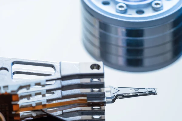 Disassembled hard disk drive inside close-up, spindle, actuator arm, read write head, platter — Stock Photo, Image