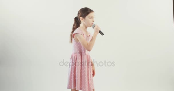 Little girl singing with microphone — Stock Video