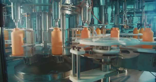 Filling of chemical bottles in a production line — Stock Video