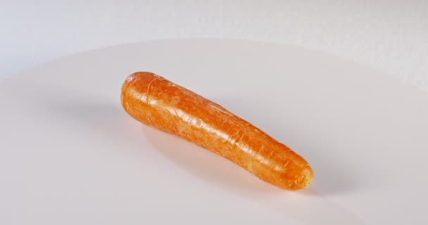 Carrots rotating on white background — Stock Video