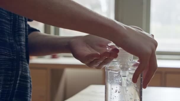 Corona pandemic - kids hands using hand sanitizer to prevent coronavirus spread — Stock Video