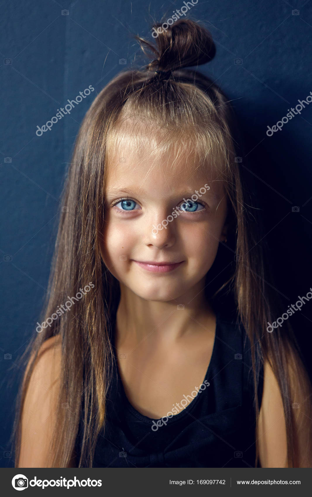 Baby Girl With Long Hair In Leather Jacket Standing Stock Photo