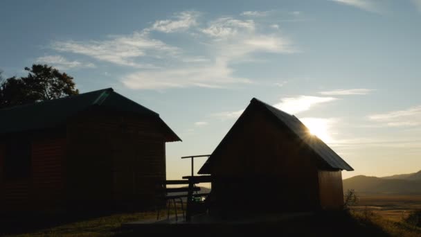 Wooden house in a village at dawn in a village near a field in Montenegro — Stock Footage Wooden house in a village at dawn in a village near a field in Montenegro Royalty Free Stock Footage