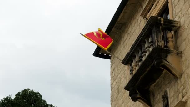 red flag of Montenegro hangs on a house