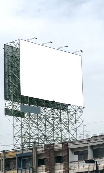 Blank billboard ready for new advertisement. Blank billboard against blue sky, put your own text here.