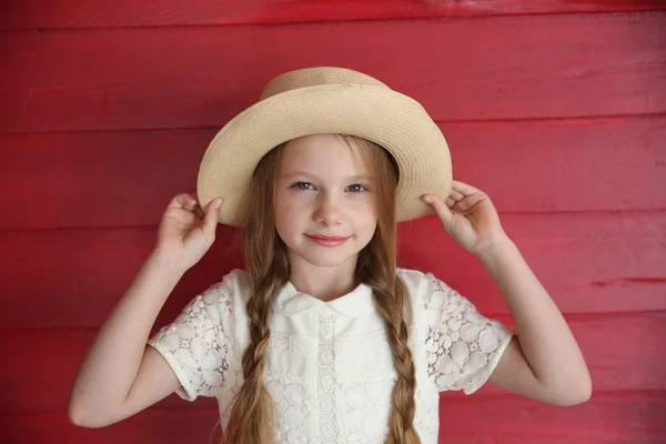 Red Haired Girl Wearing White Dress Hat Background Red Wooden — Stock Photo, Image