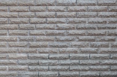 Gri taştan bir duvarın arka planı. Dekoratif taşın dokusu.