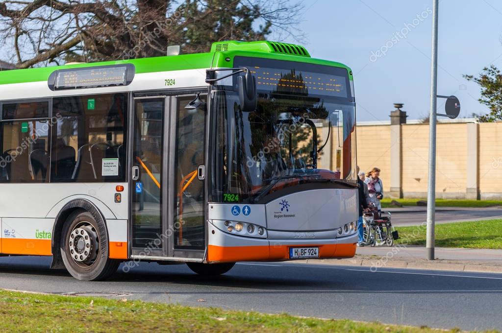 HANNOVER / GERMANY - MARCH 12, 2017: regular bus from UESTRA drives on route to the next stop. UESTRA is the operator of public transport in the city of Hanover, Germany