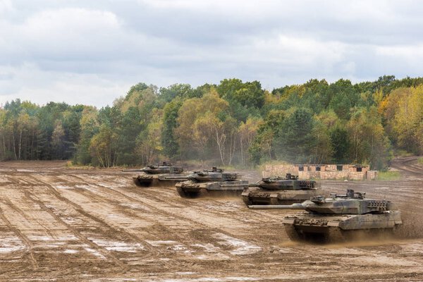 german main battle tanks drives on battlefield