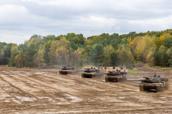 german main battle tanks drives on battlefield