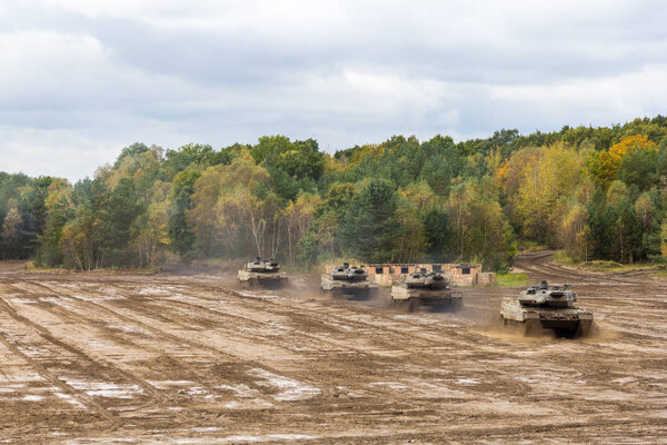 german main battle tanks drives on battlefield