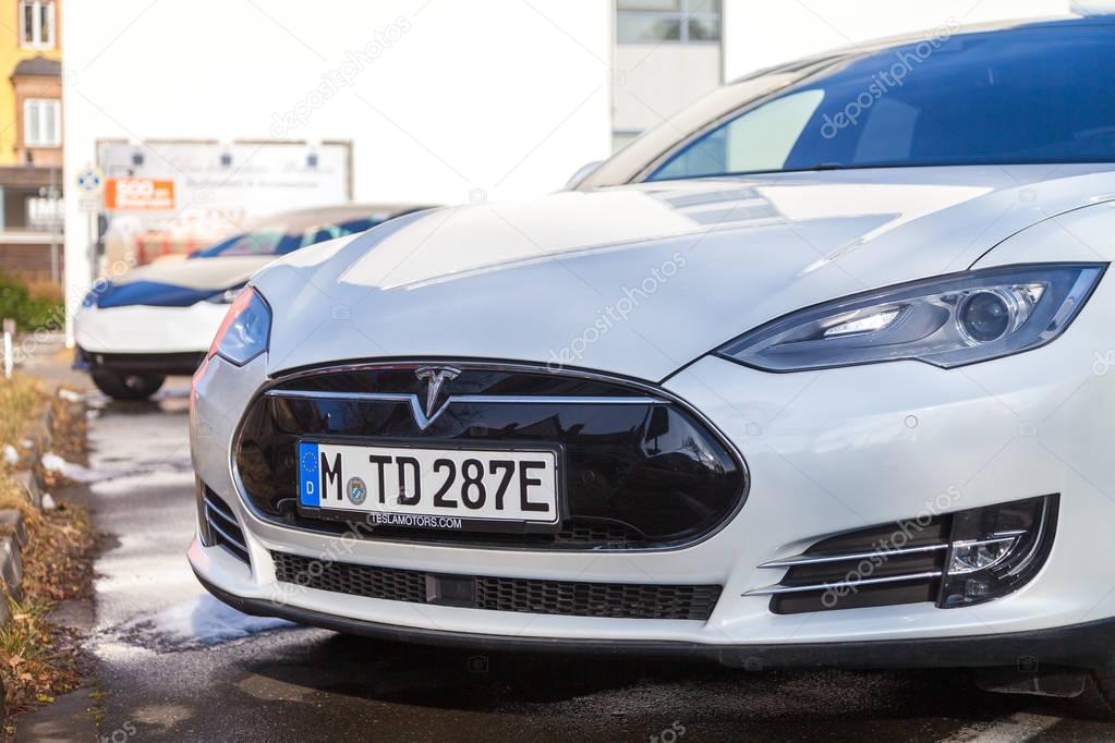 FUERTH / GERMANY - MARCH 4, 2018: Tesla logo on a Tesla car Tesla, Inc. is an American company that specializes in electric automotives, energy storage and solar panel manufacturing.