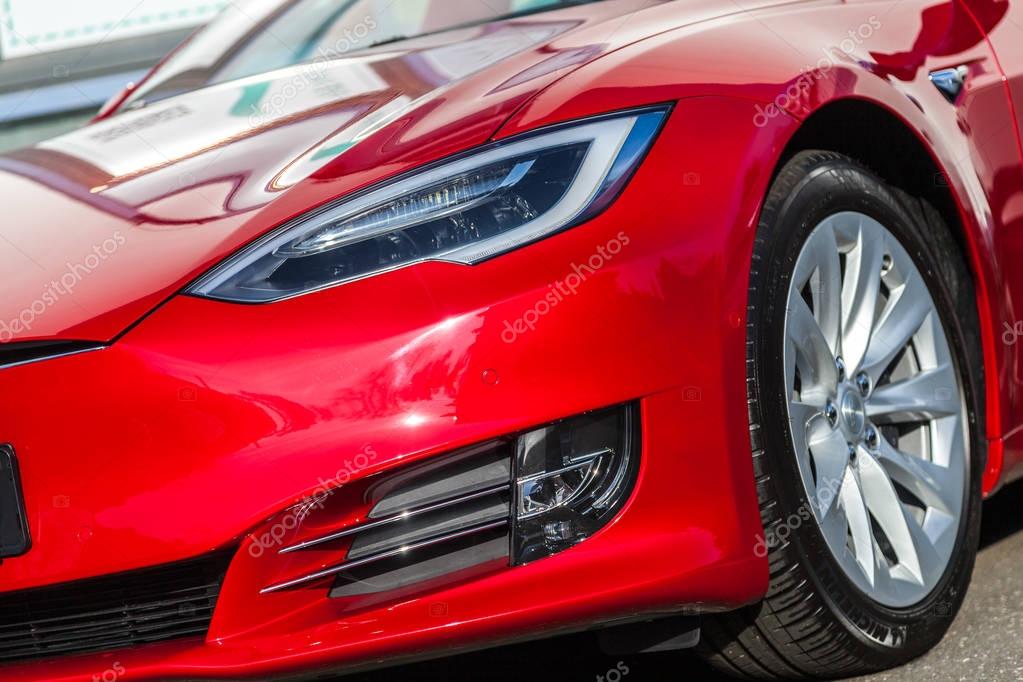 FUERTH / GERMANY - MARCH 4, 2018: Tesla logo on a Tesla car Tesla, Inc. is an American company that specializes in electric automotives, energy storage and solar panel manufacturing.