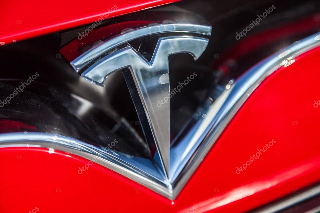 FUERTH / GERMANY - MARCH 4, 2018: Tesla logo on a Tesla car Tesla, Inc. is an American company that specializes in electric automotives, energy storage and solar panel manufacturing.