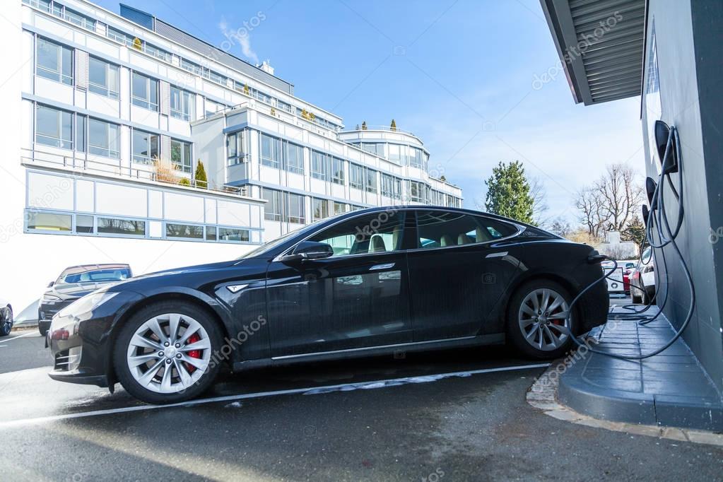 FUERTH / GERMANY - MARCH 4, 2018: Tesla logo on a Tesla car Tesla, Inc. is an American company that specializes in electric automotives, energy storage and solar panel manufacturing.