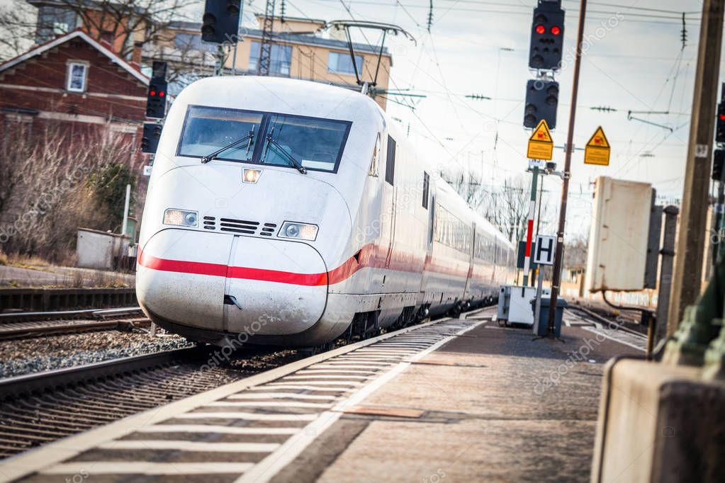 a german train passes a train station