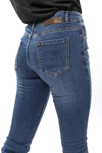 Flicka Jeans Visar Upp Jeans Vit Bakgrund Närbild Blå Jeans — Stockfoto