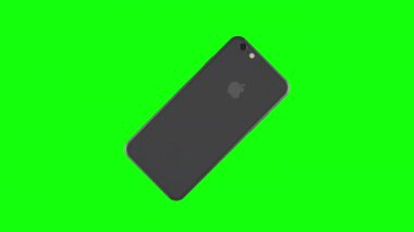 Gümüş telefon yeşil arka plan üzerinde döndürme