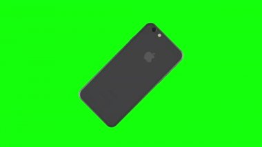 Gümüş telefon yeşil arka plan üzerinde döndürme