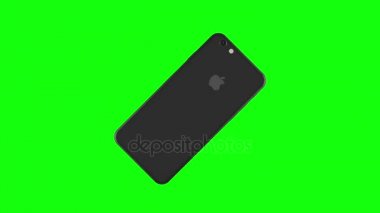 Alan gri telefon yeşil arka plan üzerinde döner.