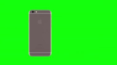 Altın telefon yeşil arka plan üzerinde dönen gül