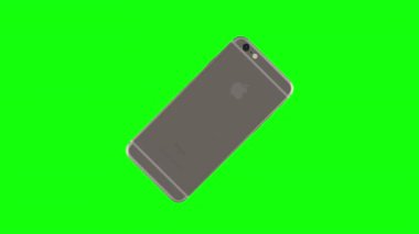 Gümüş telefon yeşil arka plan üzerinde döndürme