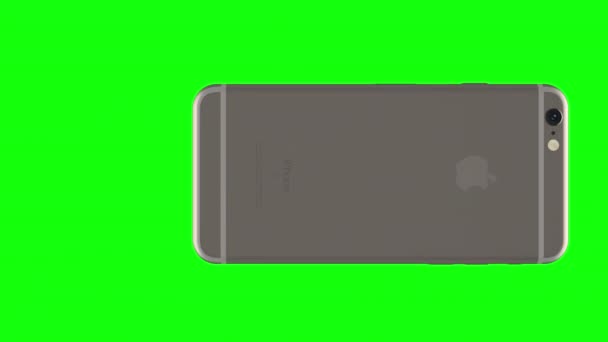Zilveren telefoon draaien op groene achtergrond — Stockvideo