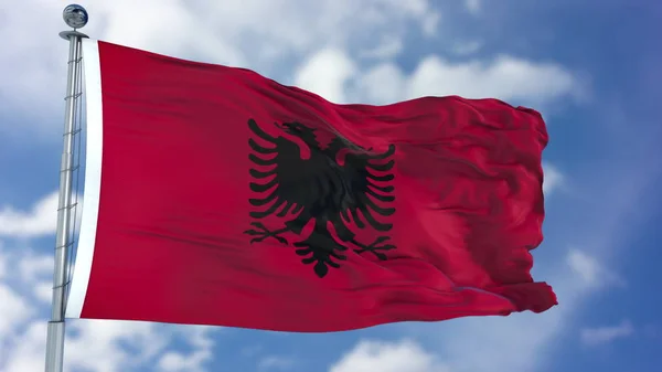 Albánie vlajka v modré obloze — Stock fotografie